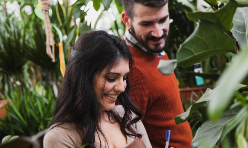 Cheerful gardeners making notes