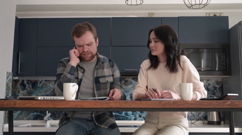 spouses resolving a financial issue at the dinner table